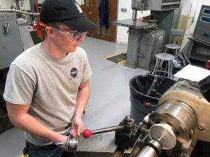 AE undergrad Carson Coursey working in the machine shop