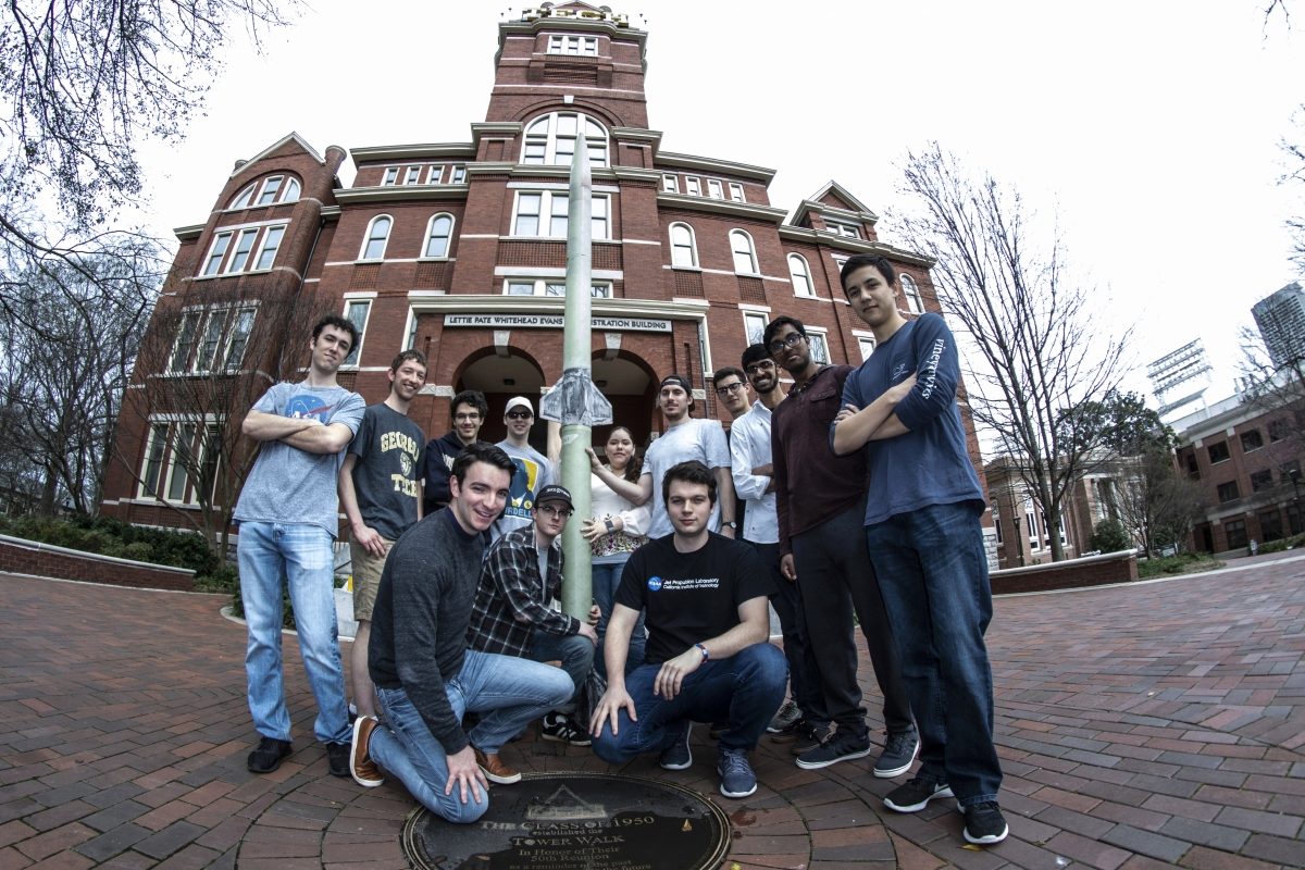 Team Stayin Alive is seen here posing with their prized rocket in front of the Tech Tower