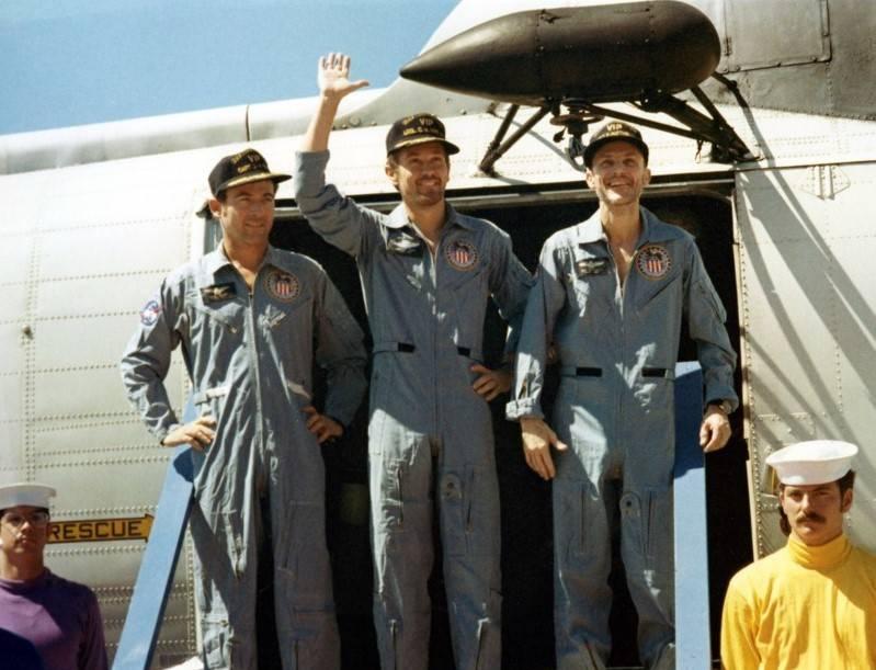 Apollo 16 astronauts John W. Young, left, Charles M. Duke, and Thomas K. “Ken” Mattingly exit the recovery helicopter on the deck of the prime recovery ship U.S.S. Ticonderoga