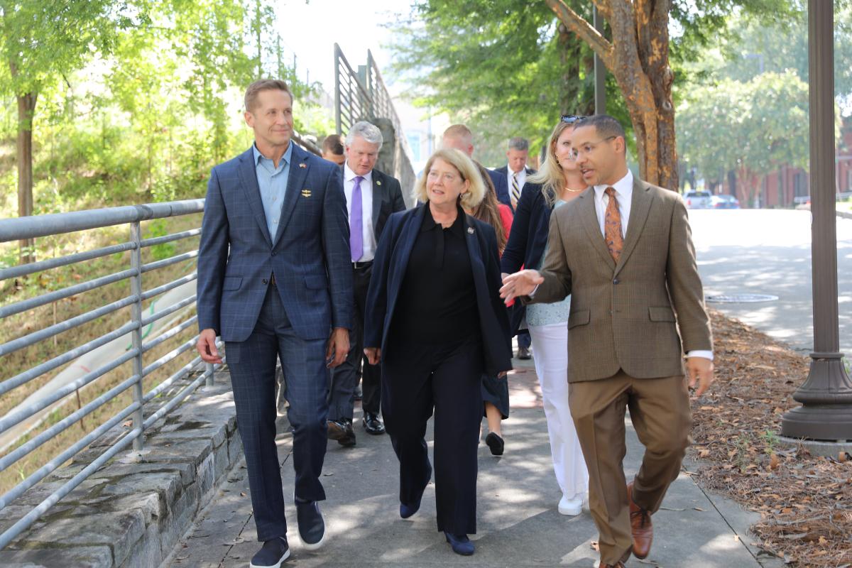 NASA Deputy Adminstrator and House of Representatives members visit Georgia Tech , shown walking with Mitchell Walker