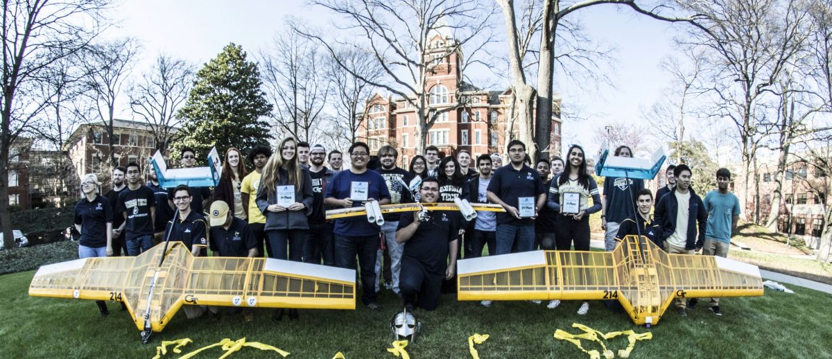 ASDL students standing in front of Tech Tower with their airplanes - Buzz3d Bom3r and Buzz-in-a-Box