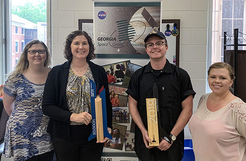 Lori Skillings, Karen Feigh, Carson Coursey, Alysia Watson with the two Spaceport America trophies