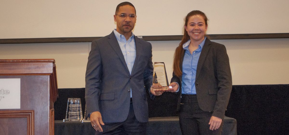 Prof. Walker standing with Kelsey Pepper