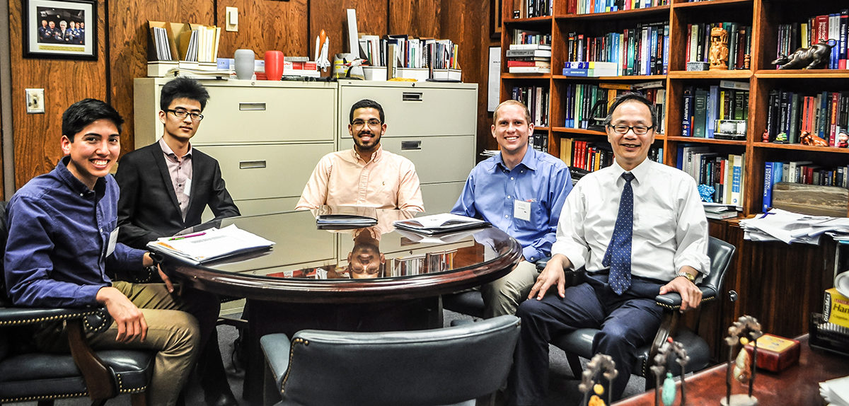 Vigor Yang meeting with students in his office