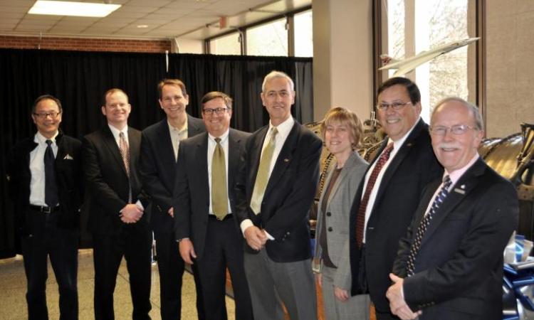 <p><strong>Welcoming the Olympus.<em> GT-AE Chair Vigor Yang is seen here with Joe Krok (Rolls Royce), John Leonard (CoE associate dean), Mark Rhodes (RR), Yves Berthelot , Lisa Teague (RR), Dimitri Mavris, and David Eames (retired RR). Eames's father, John, was a captain for the Concorde.</em></strong><br /><em>See more in our <a href="https://flic.kr/s/aHskquzC1j"><strong>Olympus engine slideshow</strong></a></em></p>