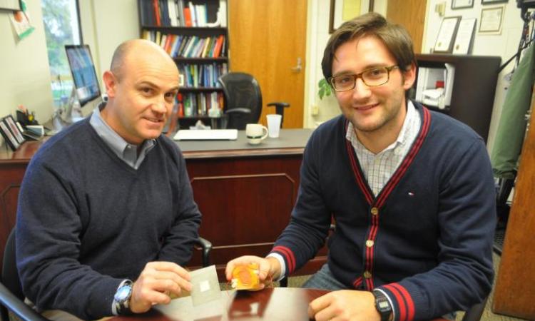<p><em>Massimo Ruzzene and doctoral student Matteo Carrara with two of the next-gen sensors they have developed, the AWR (left) and the FSAT (right)</em></p>
