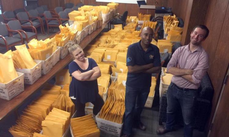 <p>Prof. <strong>Stephen Ruffin</strong>, center, with Georgia Space Grant Consortium staffers <strong>Alysia Watson</strong> and <strong>Michael Roberts</strong>, breathed sighs of relief late Thursday night after volunteers finished packaging the eclipse packs.</p>