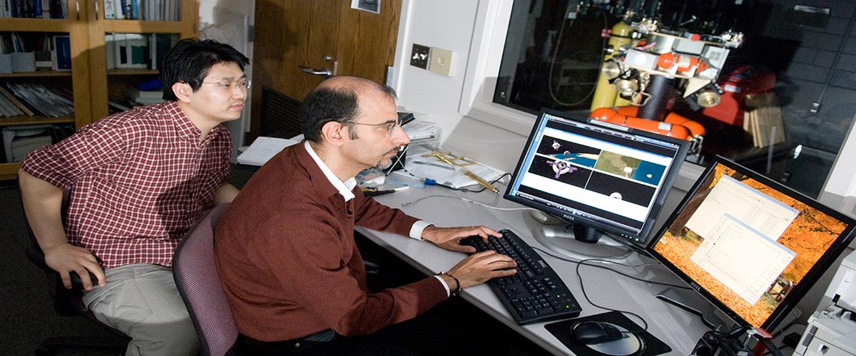 two people looking at screens