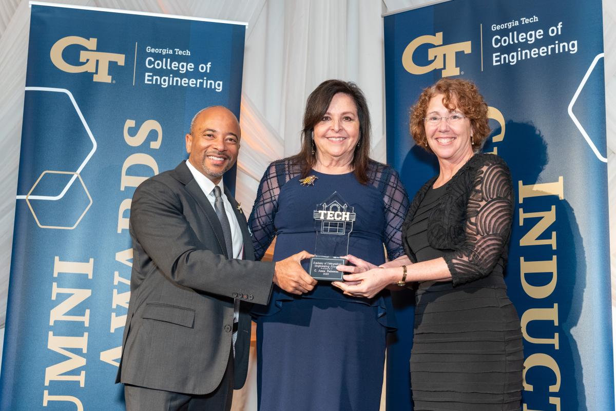 Anne Patterson receives her College of Engineering award with Dean Beyah (left) and Sandy Magnus (right)