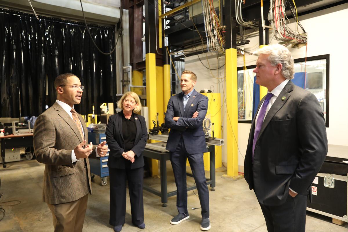 NASA Deputy Adminstrator and House of Representatives members visit Georgia Tech , shown walking with Mitchell Walker