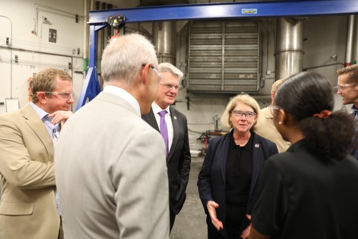 NASA Deputy Adminstrator and House of Representatives members visit Georgia Tech , shown walking with Mitchell Walker