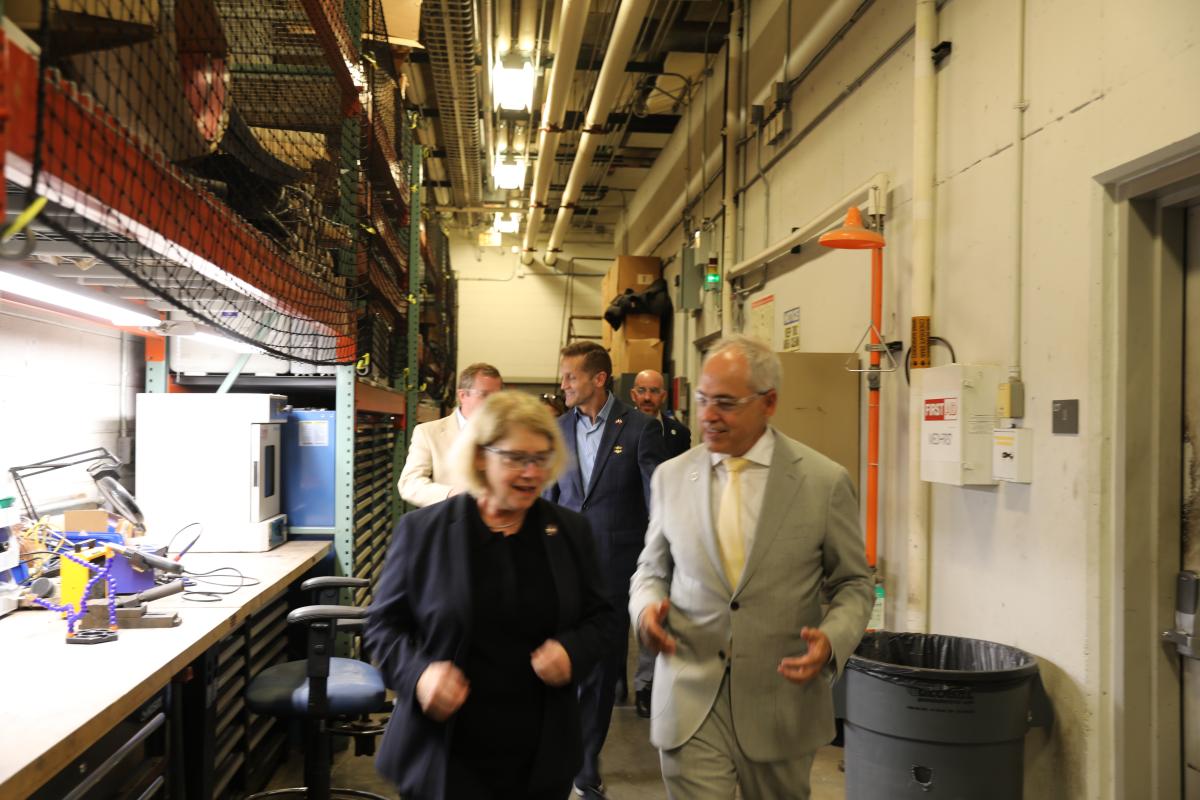 NASA Deputy Adminstrator and House of Representatives members visit Georgia Tech , shown walking with Mitchell Walker