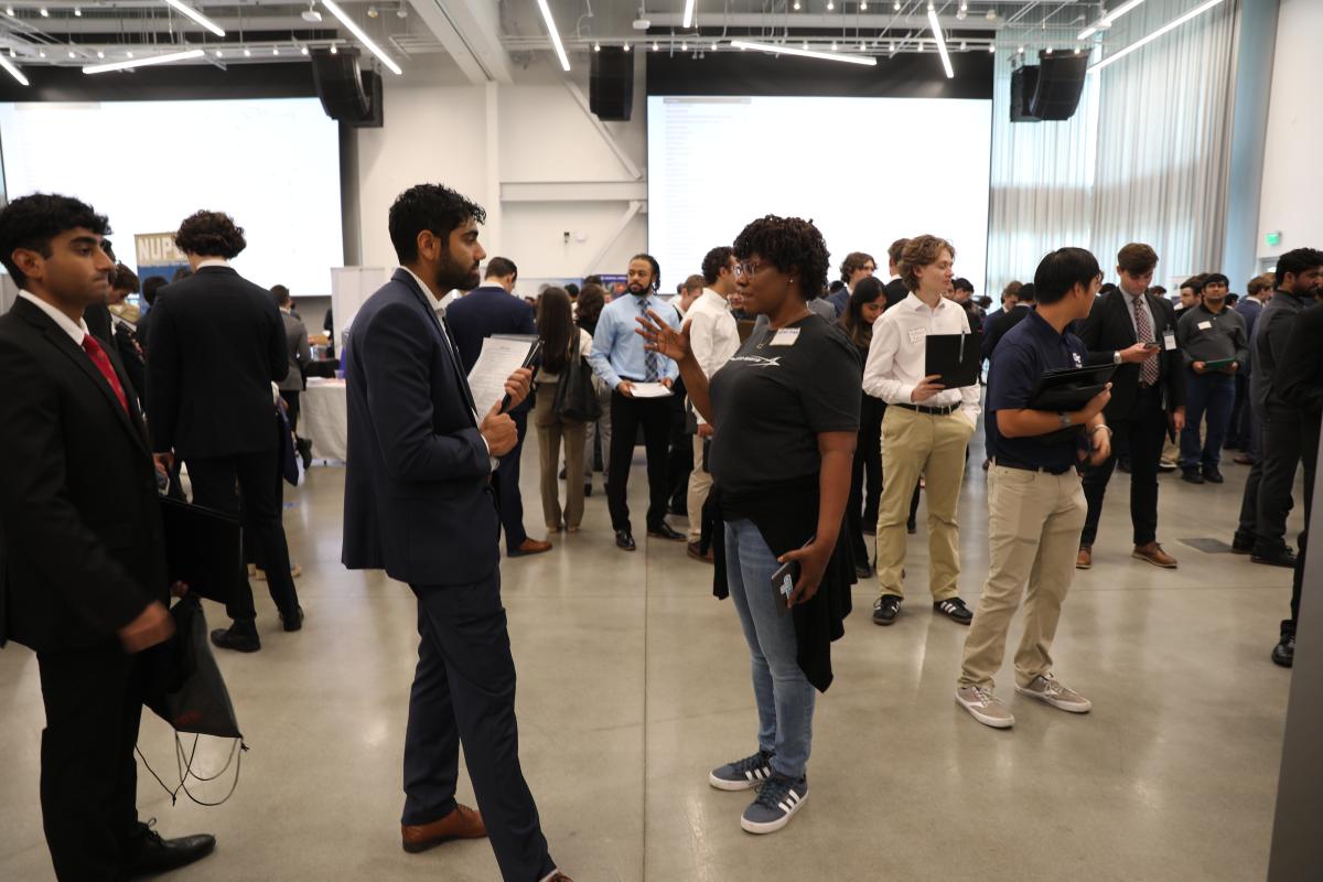 Aerospace engineering students talk with recruiters during the latest AE School Career Fair